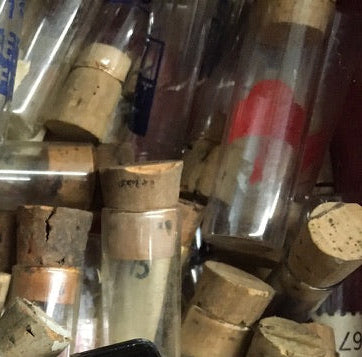 Ten antique glass watchmaker's vials