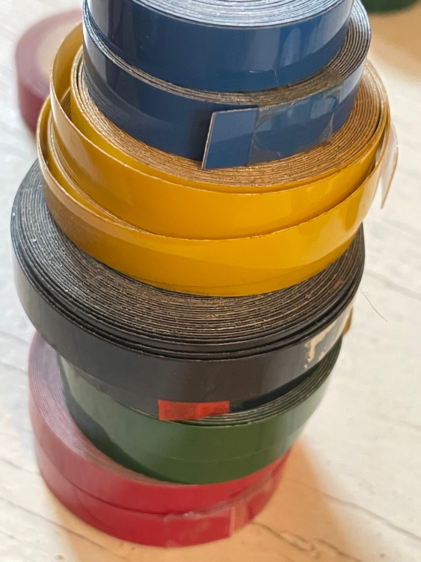 One roll of DYMO or compatible embossing tape in your choice of color and width (3/8, 1/2, 3/4”)