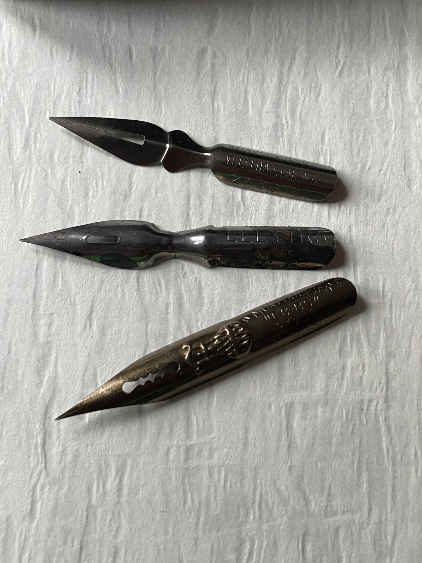 three vintage metal writing nibs