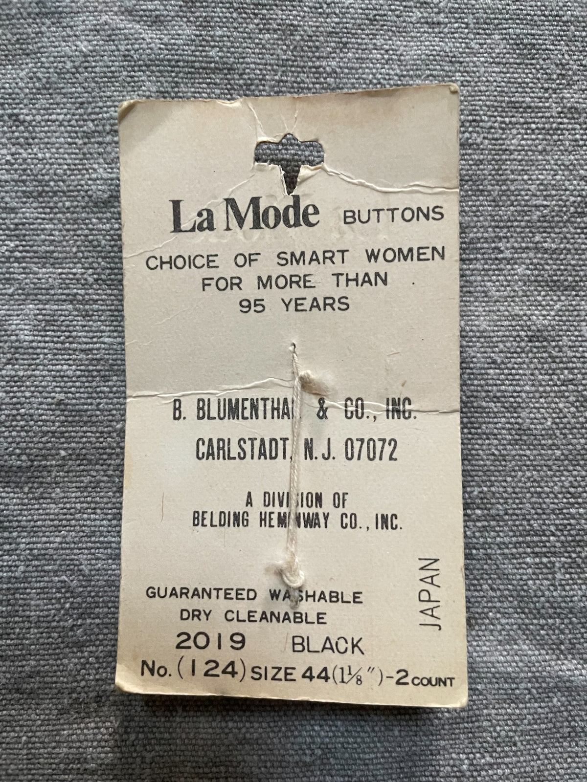 Back of original packaging card for 2 black la mode sewing buttons, 1 1/8 inch, nos on original card