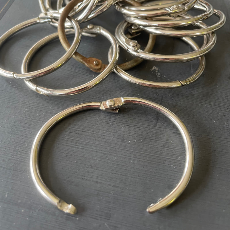 Trio of loose leaf binder rings