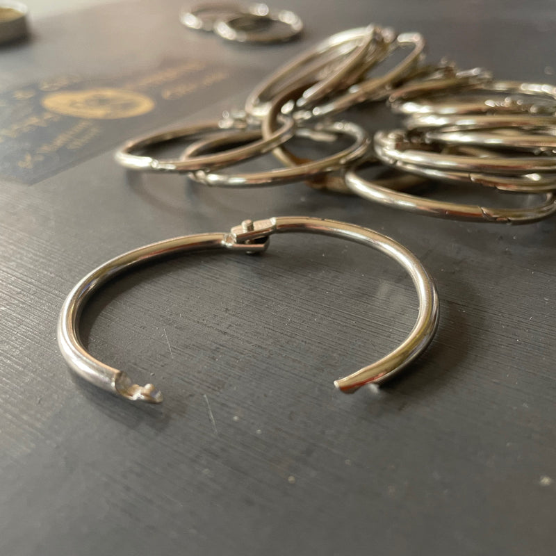 Trio of loose leaf binder rings