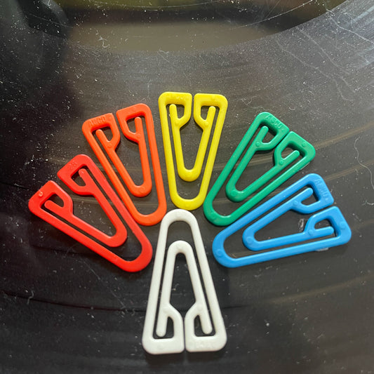 Rainbow of 80s plastic paper clips
