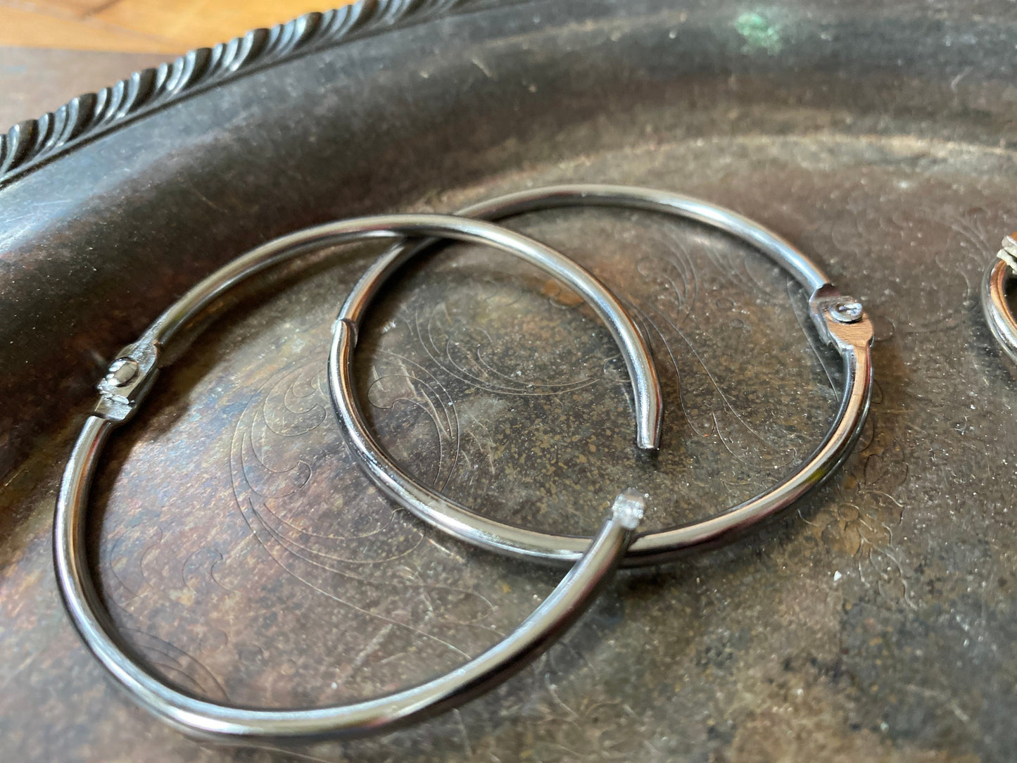 Trio of loose leaf binder rings