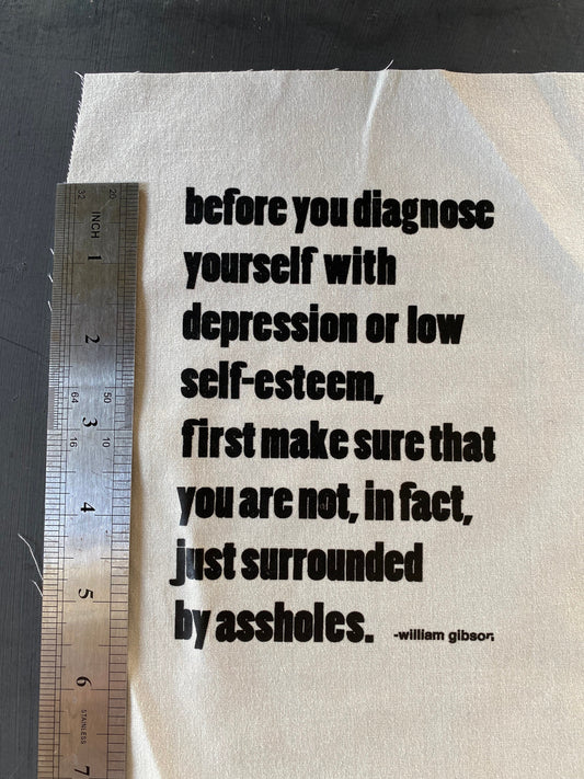 Quotation patch: “surrounded by assholes” printed on vintage fabric. Use in visible mending, sewing, embellishing, repair, stitching, gifts!
