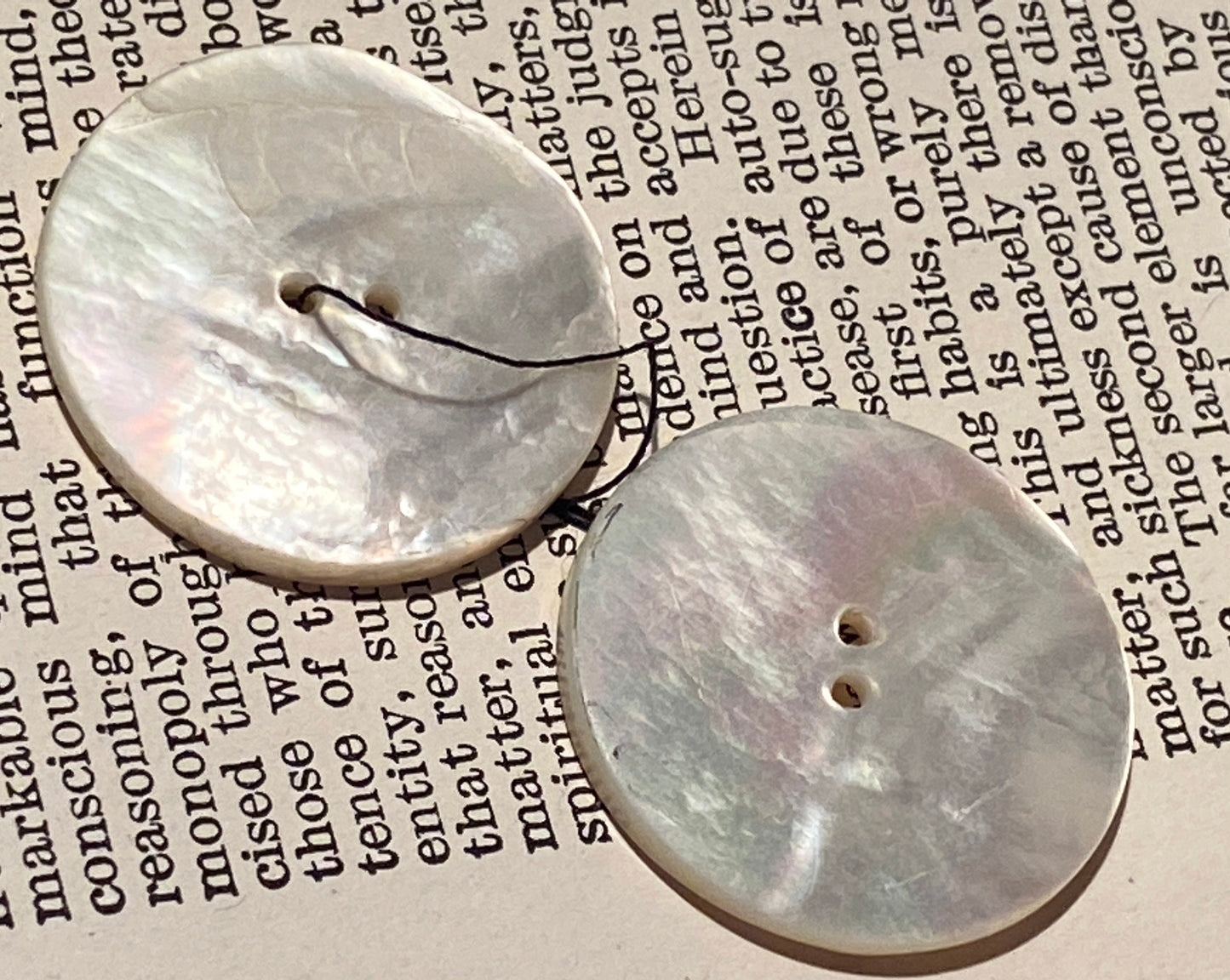 2 vtg matched abalone shell buttons: 1.125" hand carved, raised relief cat eye