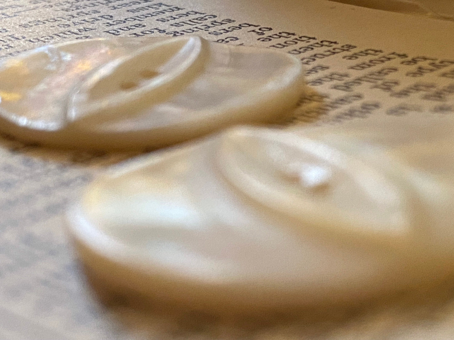 2 vtg matched abalone shell buttons: 1.125" hand carved, raised relief cat eye