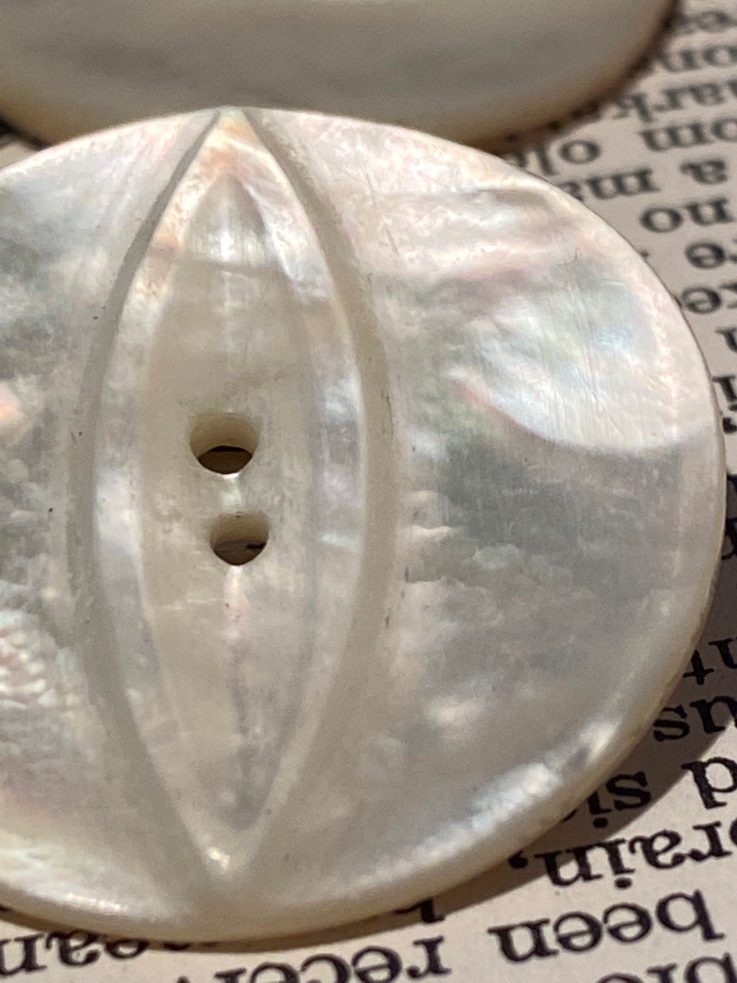 2 vtg matched abalone shell buttons: 1.125" hand carved, raised relief cat eye