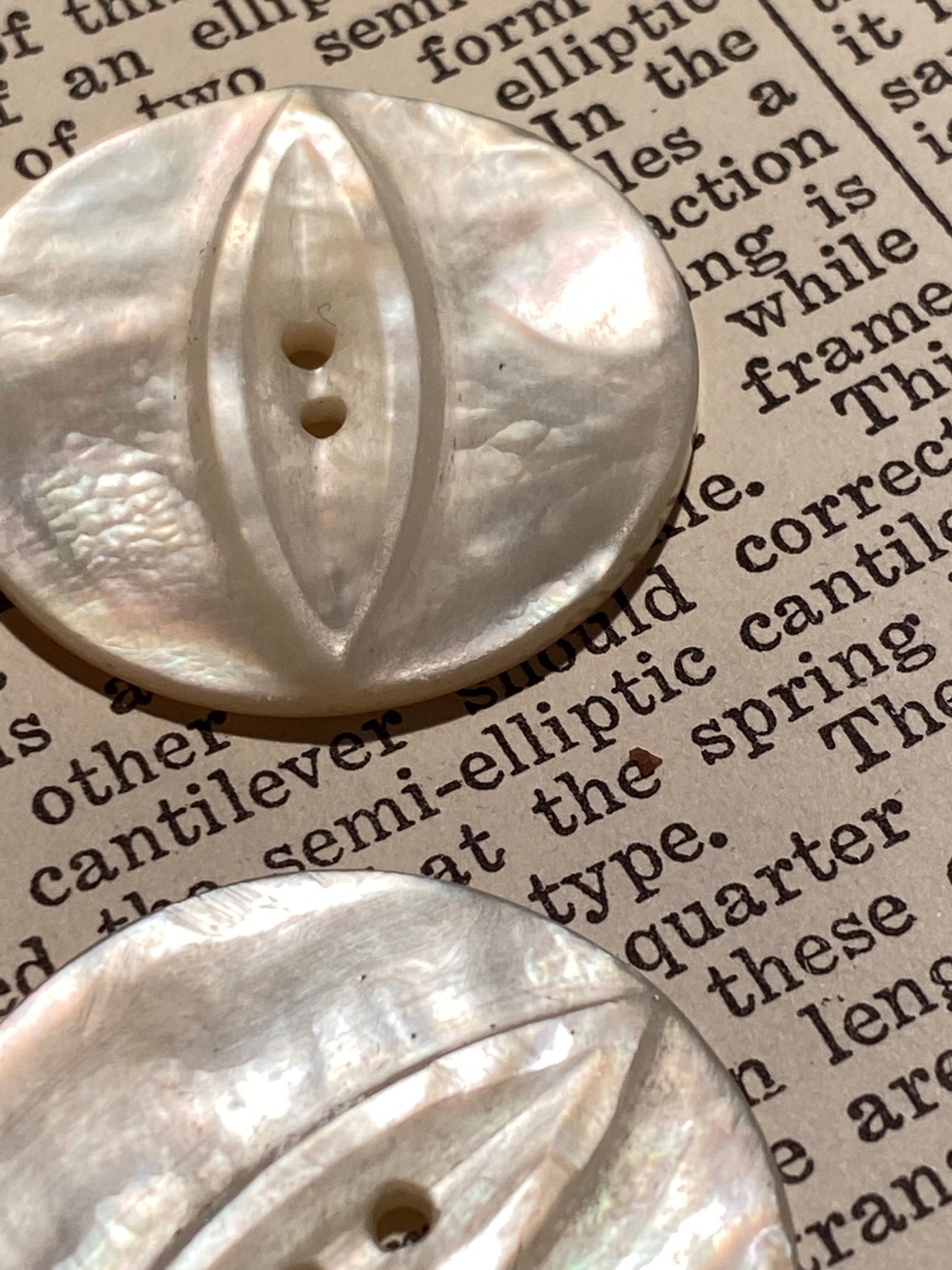 2 vtg matched abalone shell buttons: 1.125" hand carved, raised relief cat eye