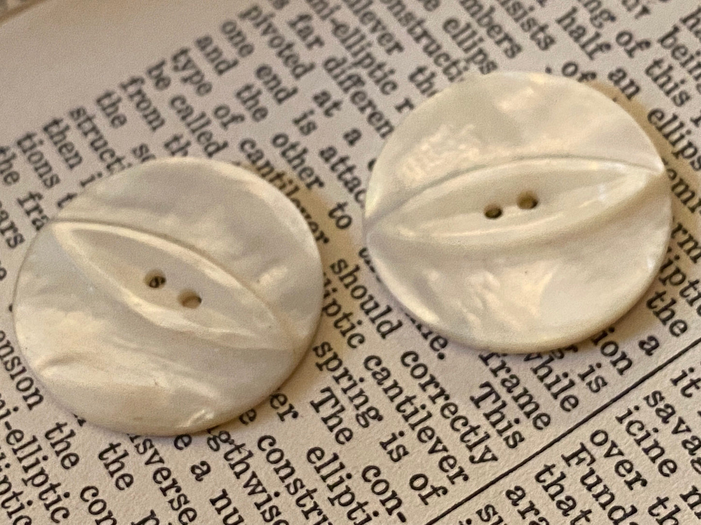 2 vtg matched abalone shell buttons: 1.125" hand carved, raised relief cat eye
