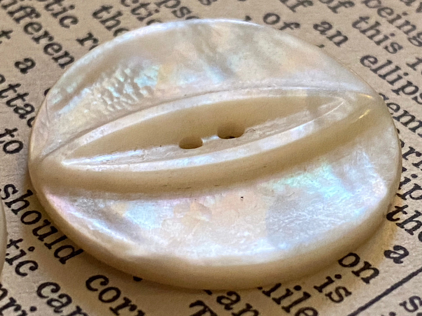 2 vtg matched abalone shell buttons: 1.125" hand carved, raised relief cat eye