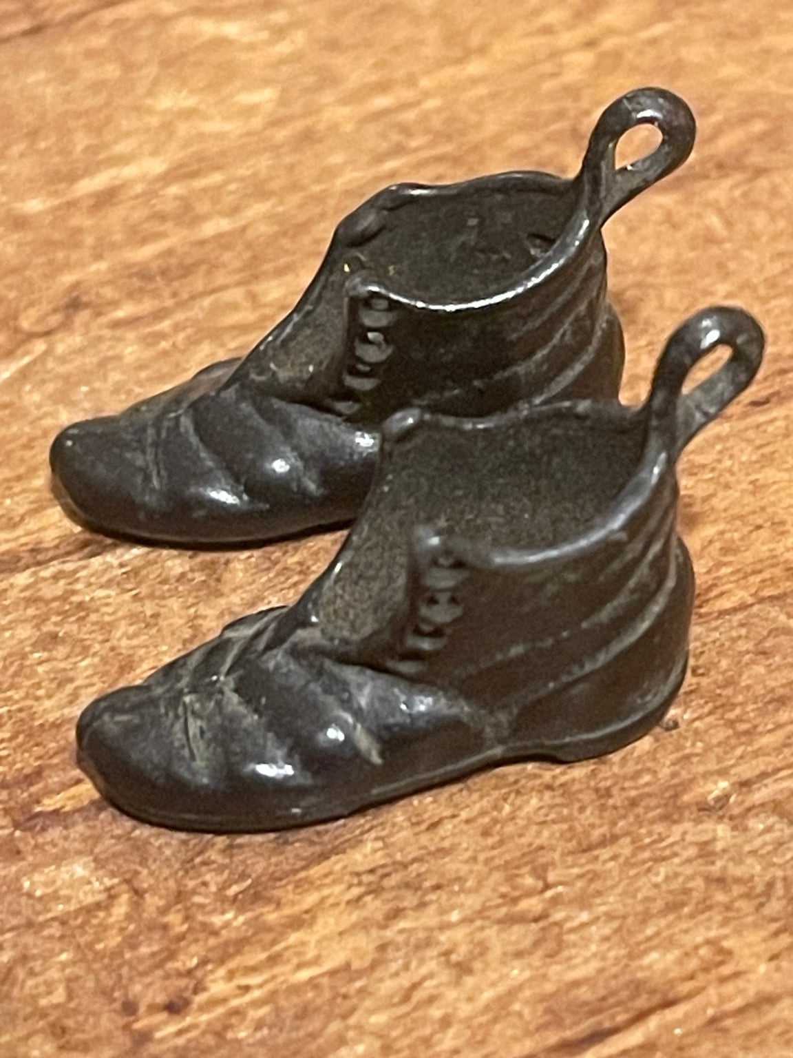 Pair of vintage miniature dark metal boot charms with heel hanging loops