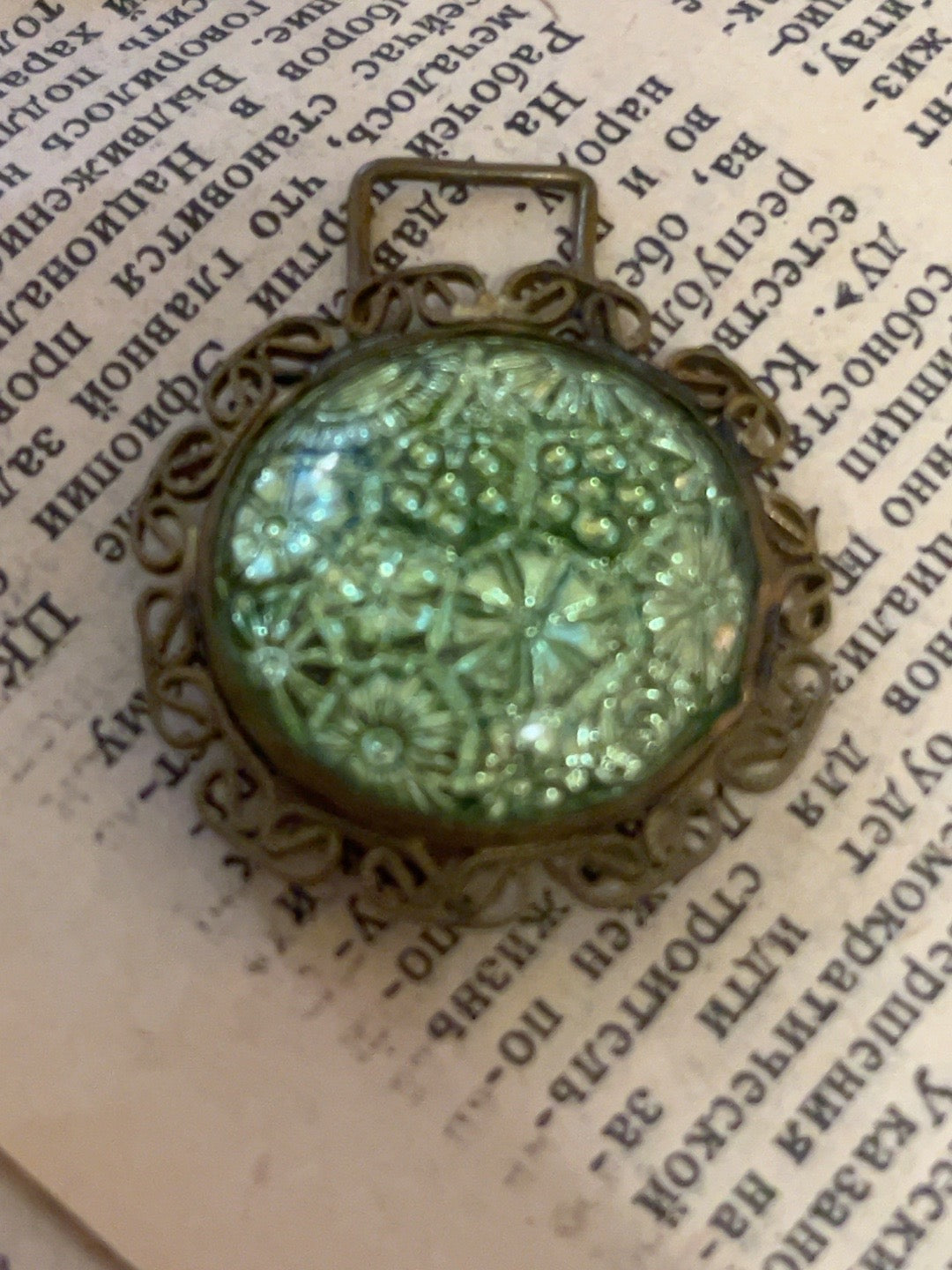 Vintage Czechoslovakia-marked accessory with iridescent floral glass and ornate filigree