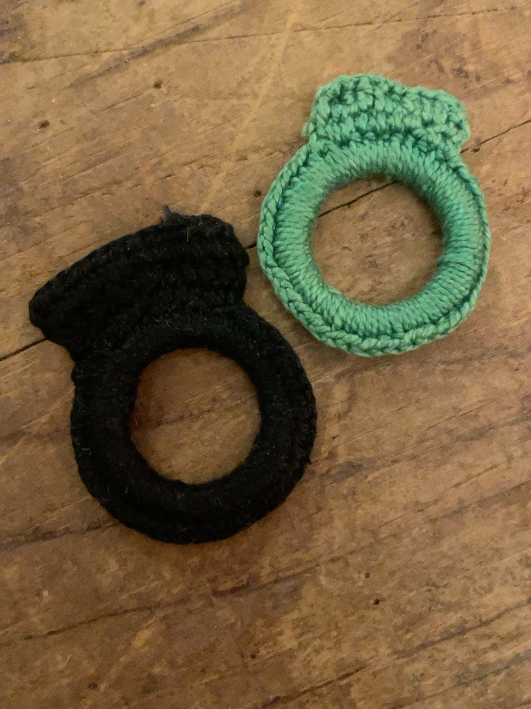 Pair of vintage black and mint-green fiber-wrapped ring pins