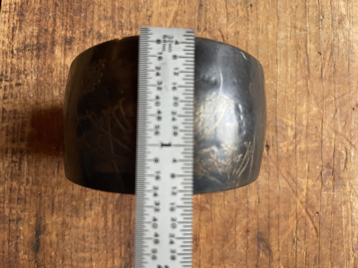 Vintage etched cuff bracelet shown with ruler for band width