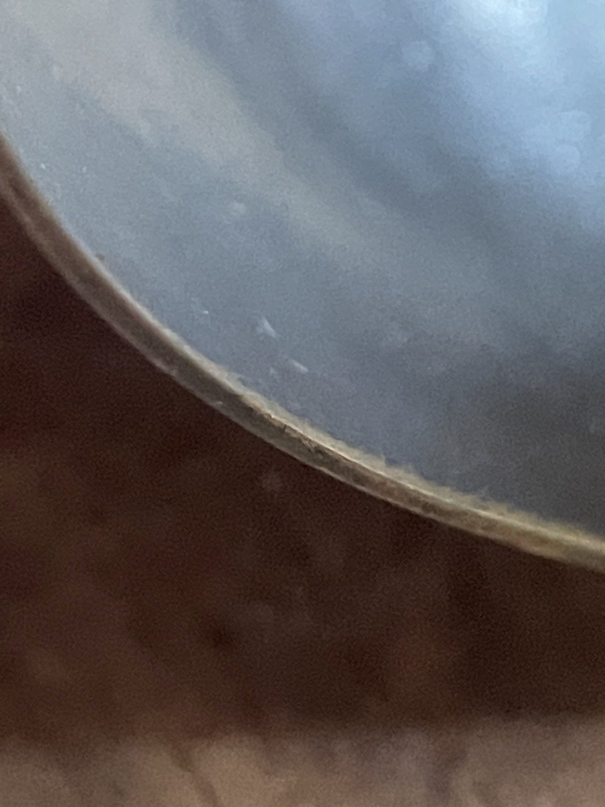 Close-up of vintage cuff bracelet edge showing patina and wear