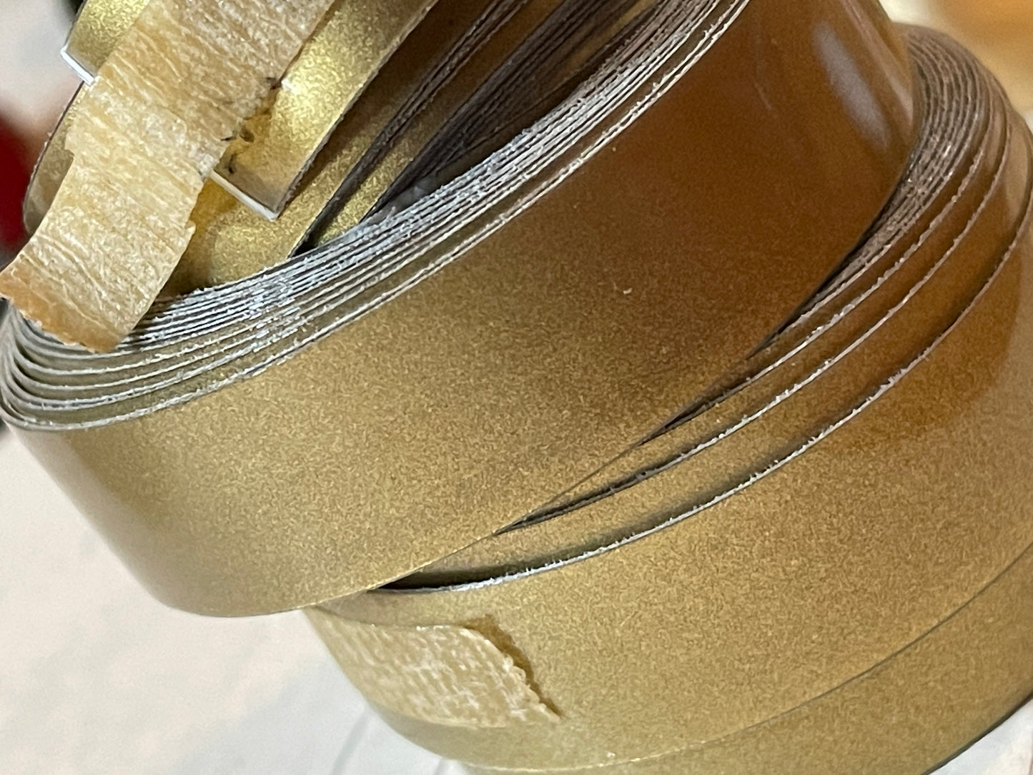 One roll of DYMO or compatible embossing tape in your choice of color and width (3/8, 1/2, 3/4”)
