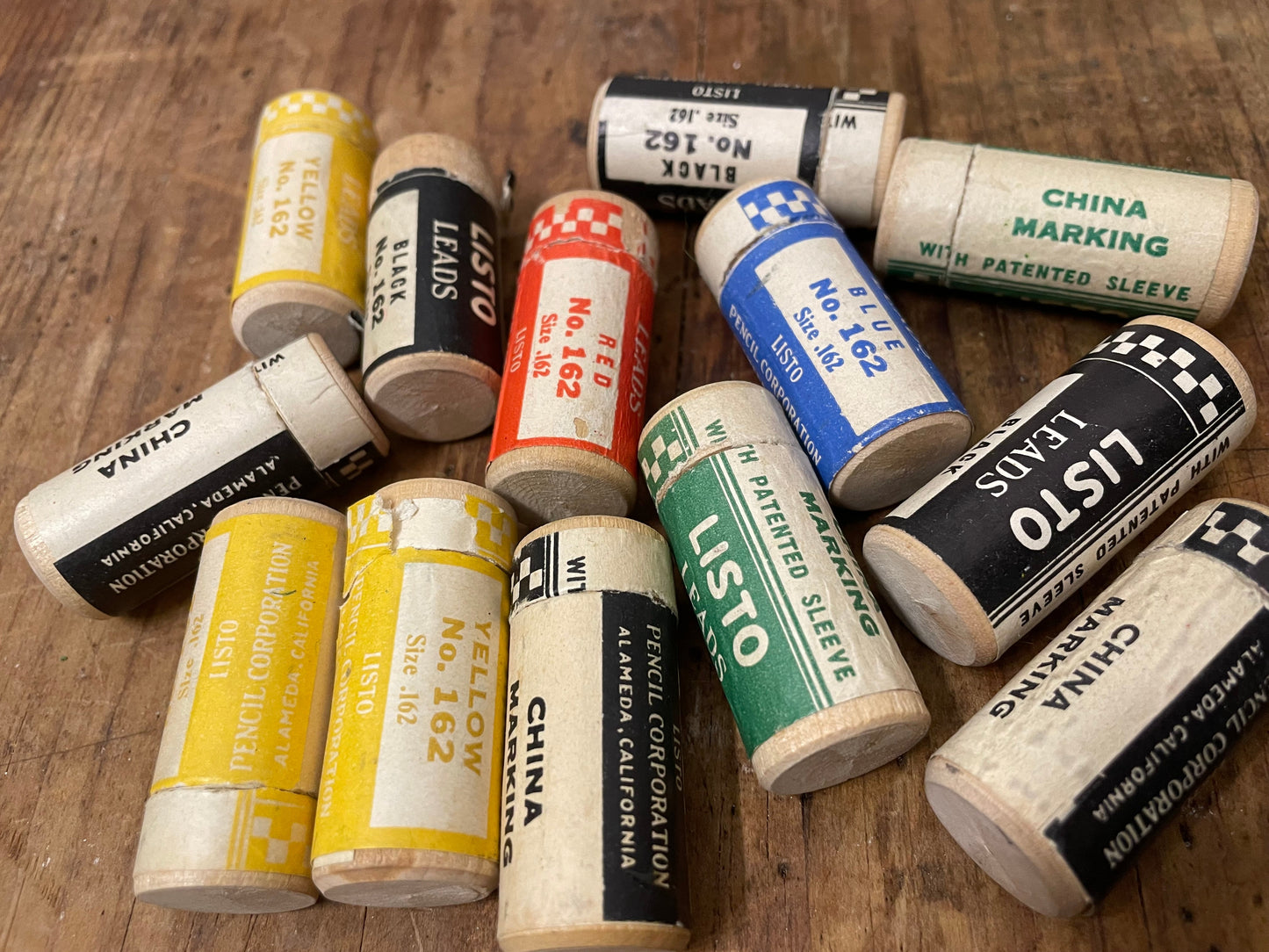 Collection of vintage w canisters with labels on a wooden surface