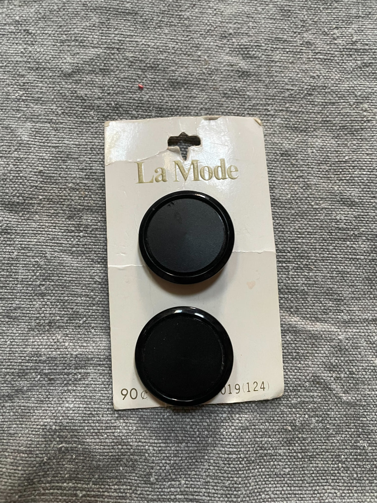 Product view of 2 black la mode sewing buttons, 1 1/8 inch, nos on original card