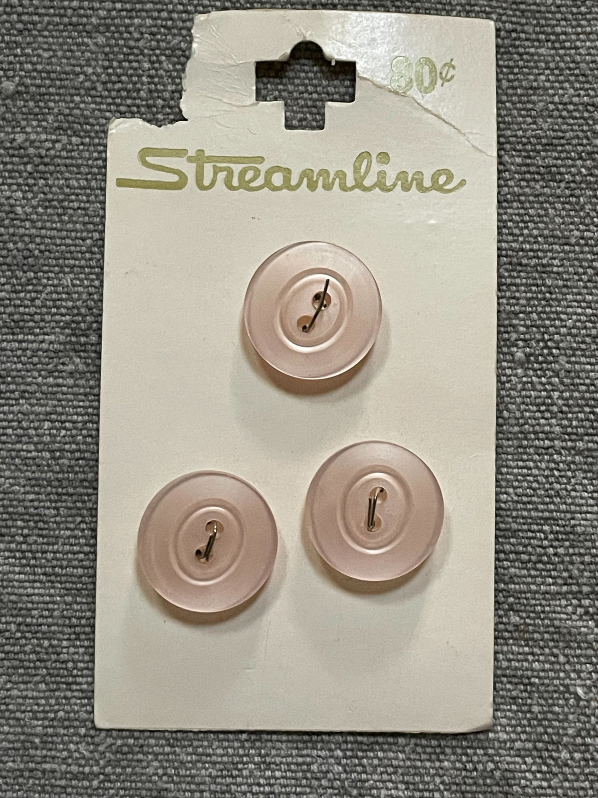 Product view of 3 pale pink streamline two-hole sewing buttons, 15.46 mm, nos