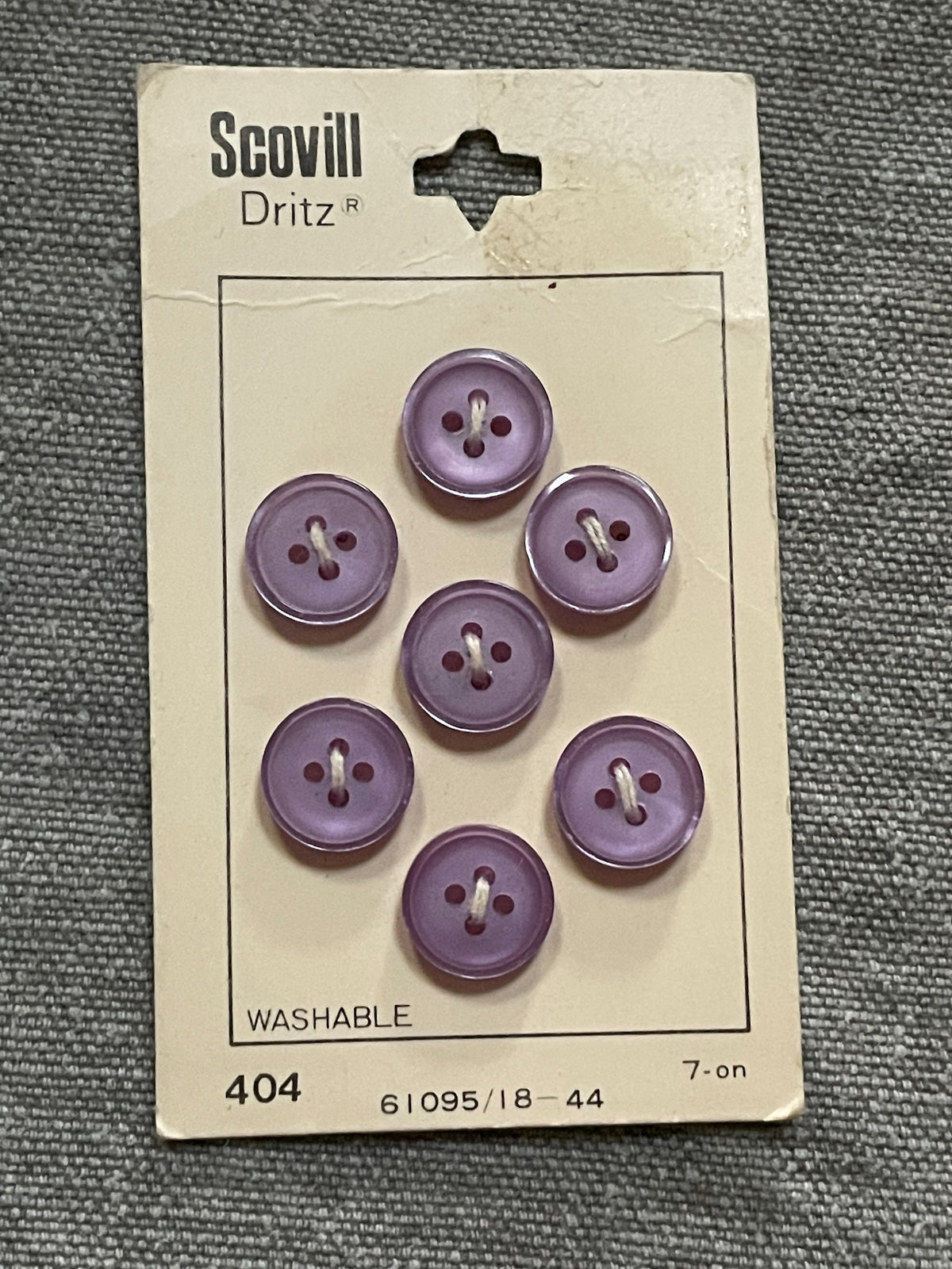 Product view of 7 purple scovill dritz four-hole sewing buttons, 11.5 mm, nos