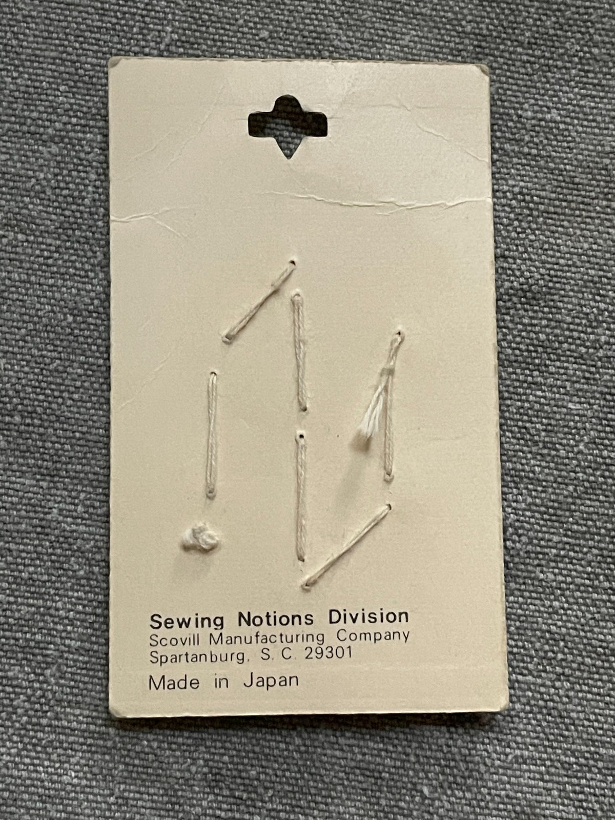 Back of original packaging card for 7 purple scovill dritz four-hole sewing buttons, 11.5 mm, nos