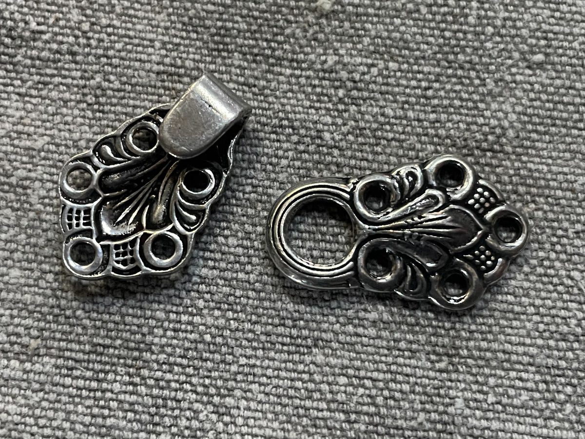Close-up detail of norwegian-style silver-tone sweater hook-and-loop closure, 45 mm