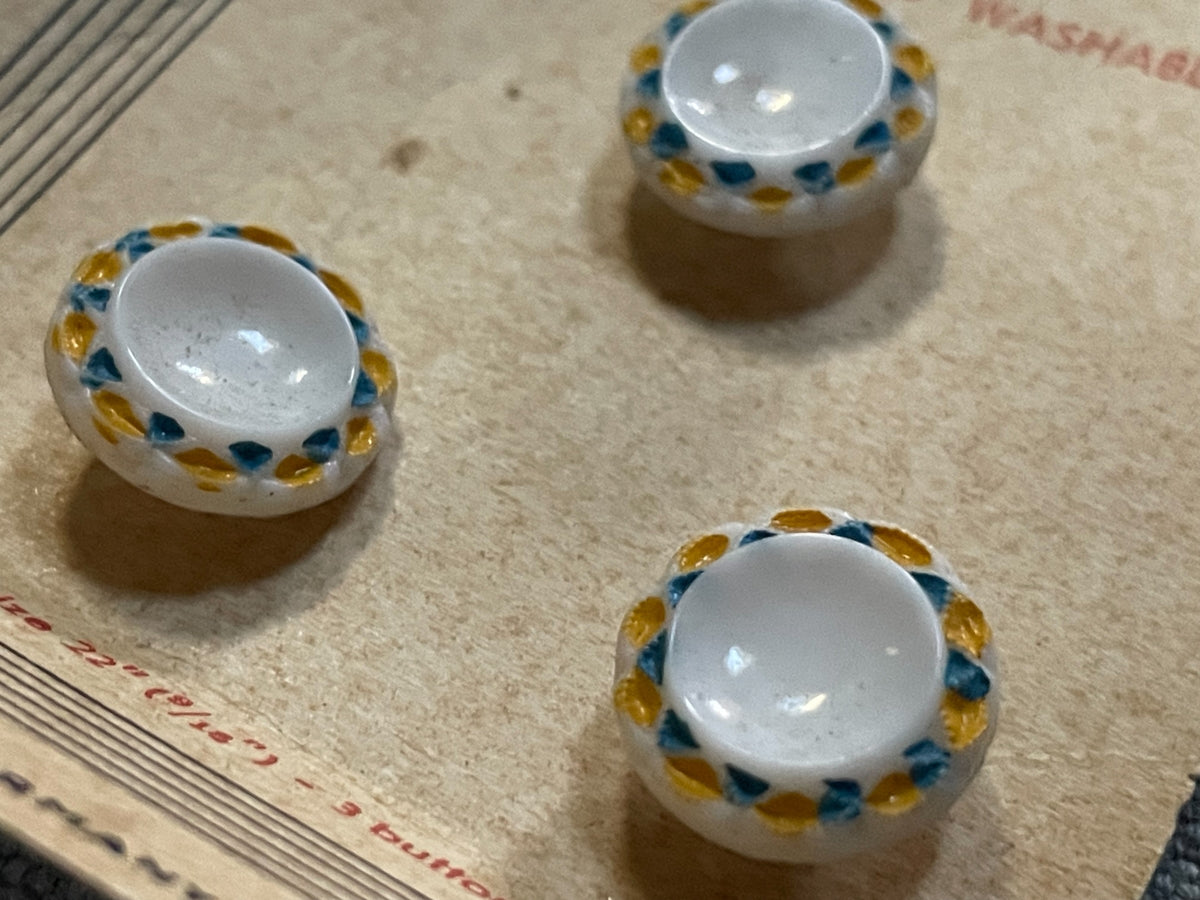 Close-up detail of 3 exquisit hand-painted sewing buttons, 9/16 inch, nos on card