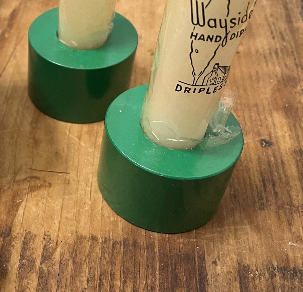 Pair of green modernist candle holders shown with vintage fireplace matches as props