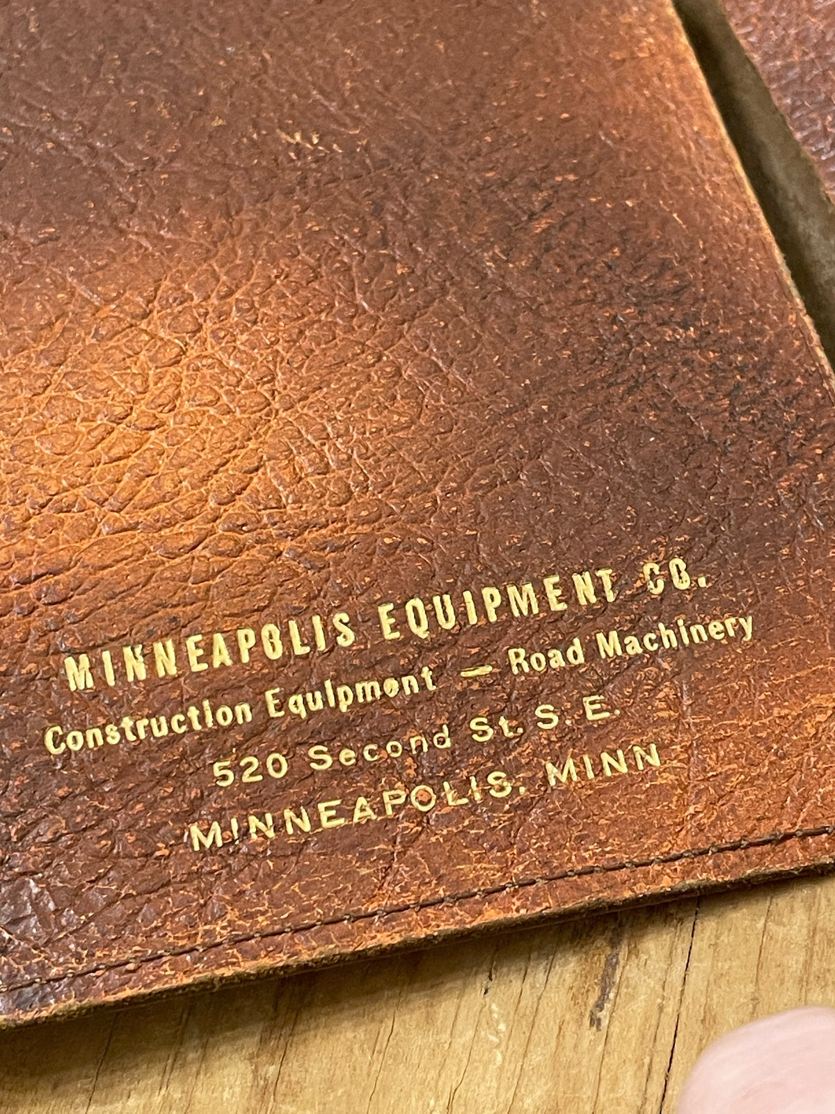 Gold Minneapolis Equipment Co. advertising imprint inside brown leather wallet