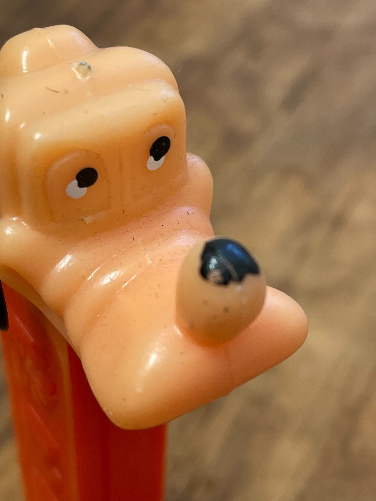 Side close-up of Goofy character head on vintage PEZ dispenser