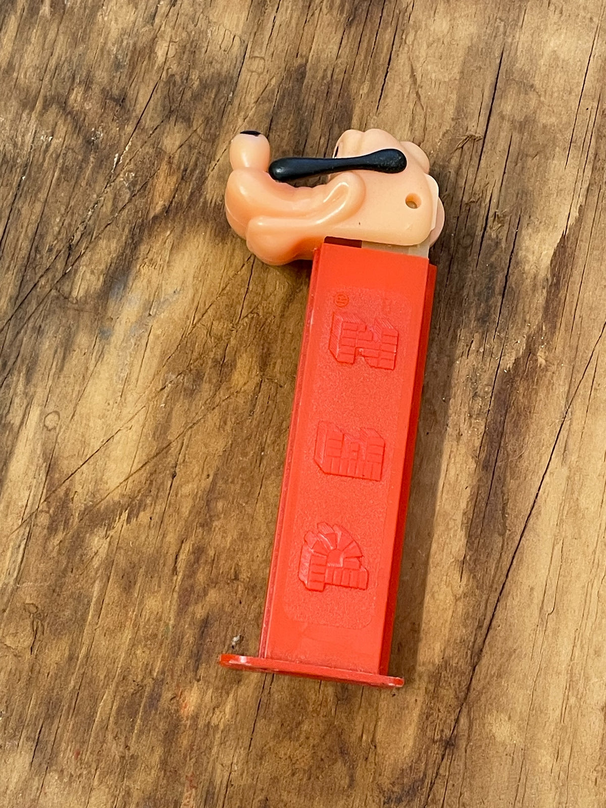 Vintage Goofy PEZ dispenser showing red no-feet stem and PEZ logo