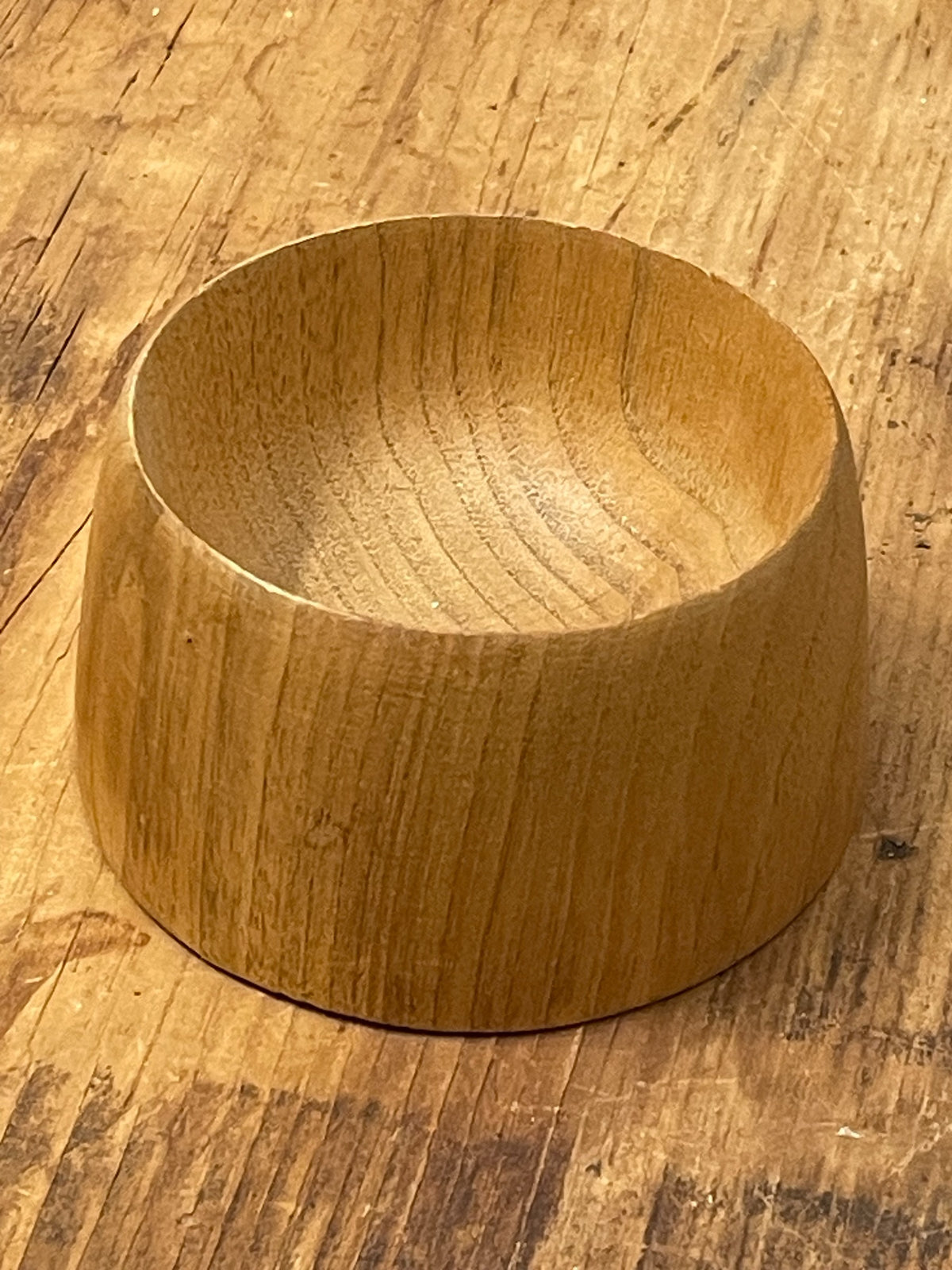 Side view of thick-walled hand-turned wooden bowl