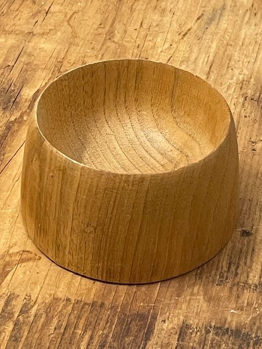 Side view of thick-walled hand-turned wooden bowl