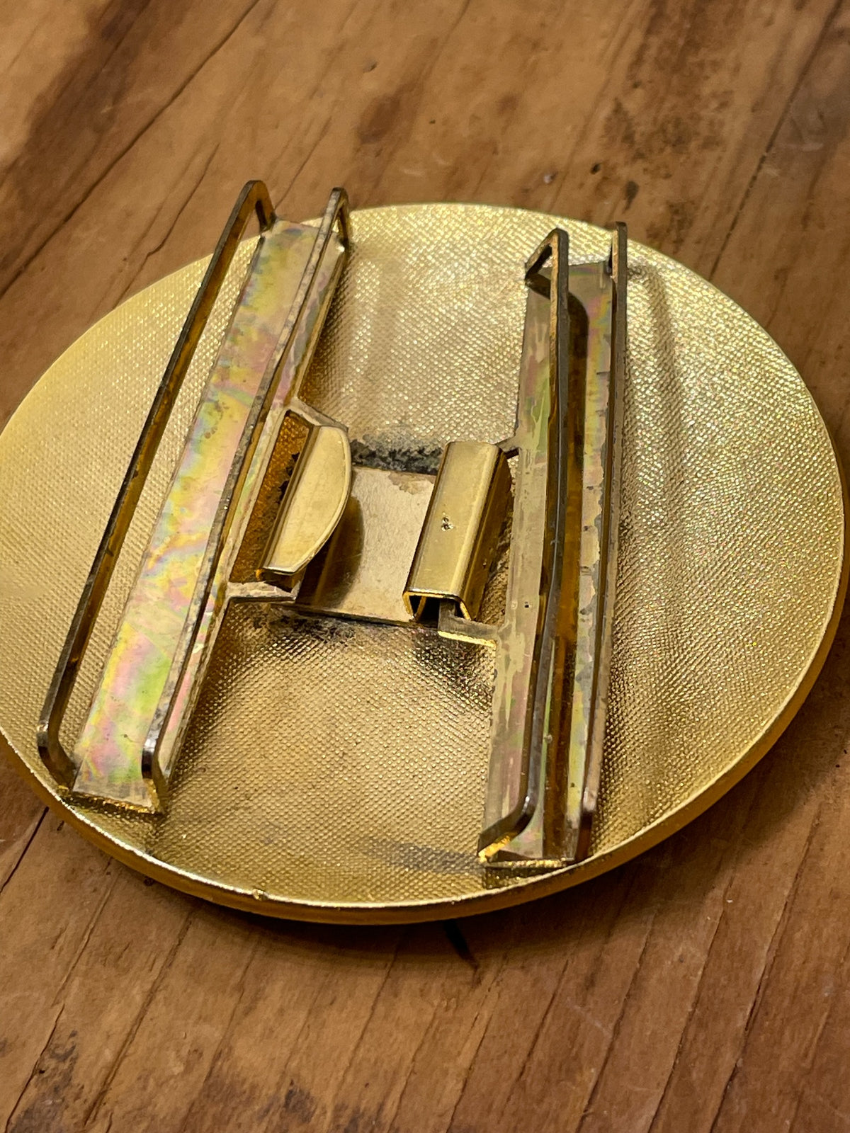 Close-up of belt buckle back and fastening hardware