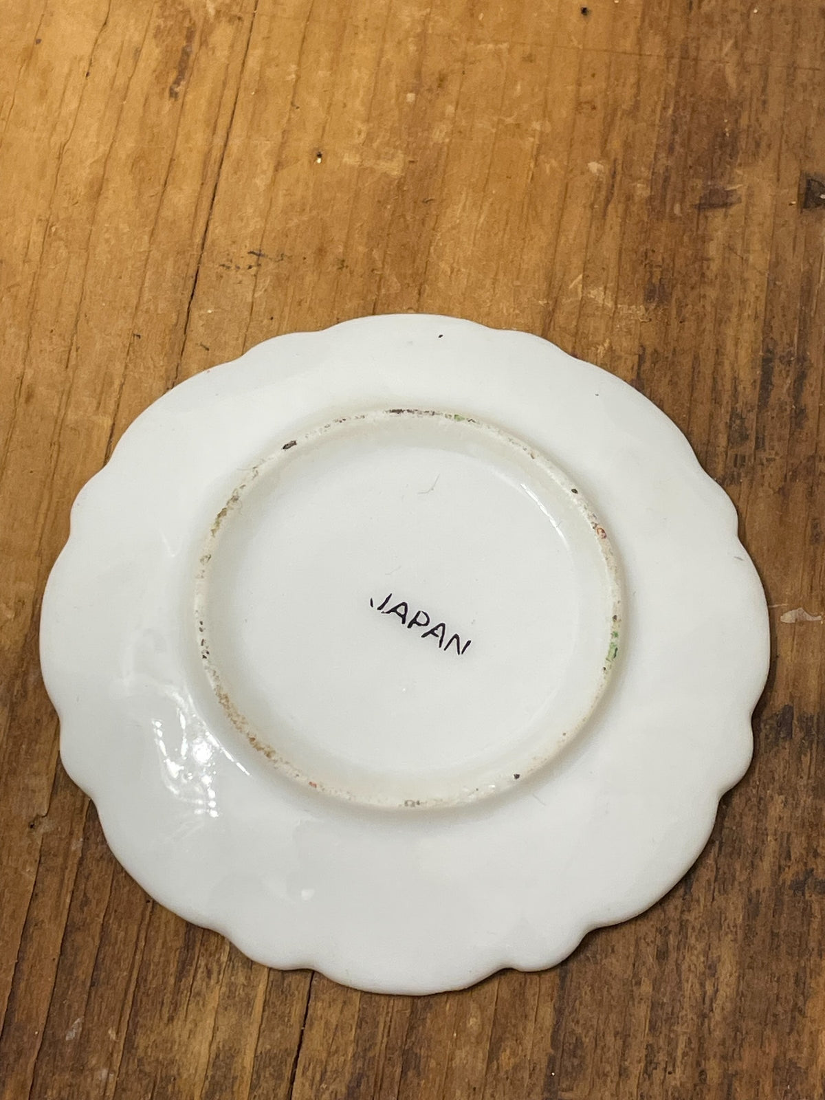 Back of miniature porcelain plate showing Japan mark