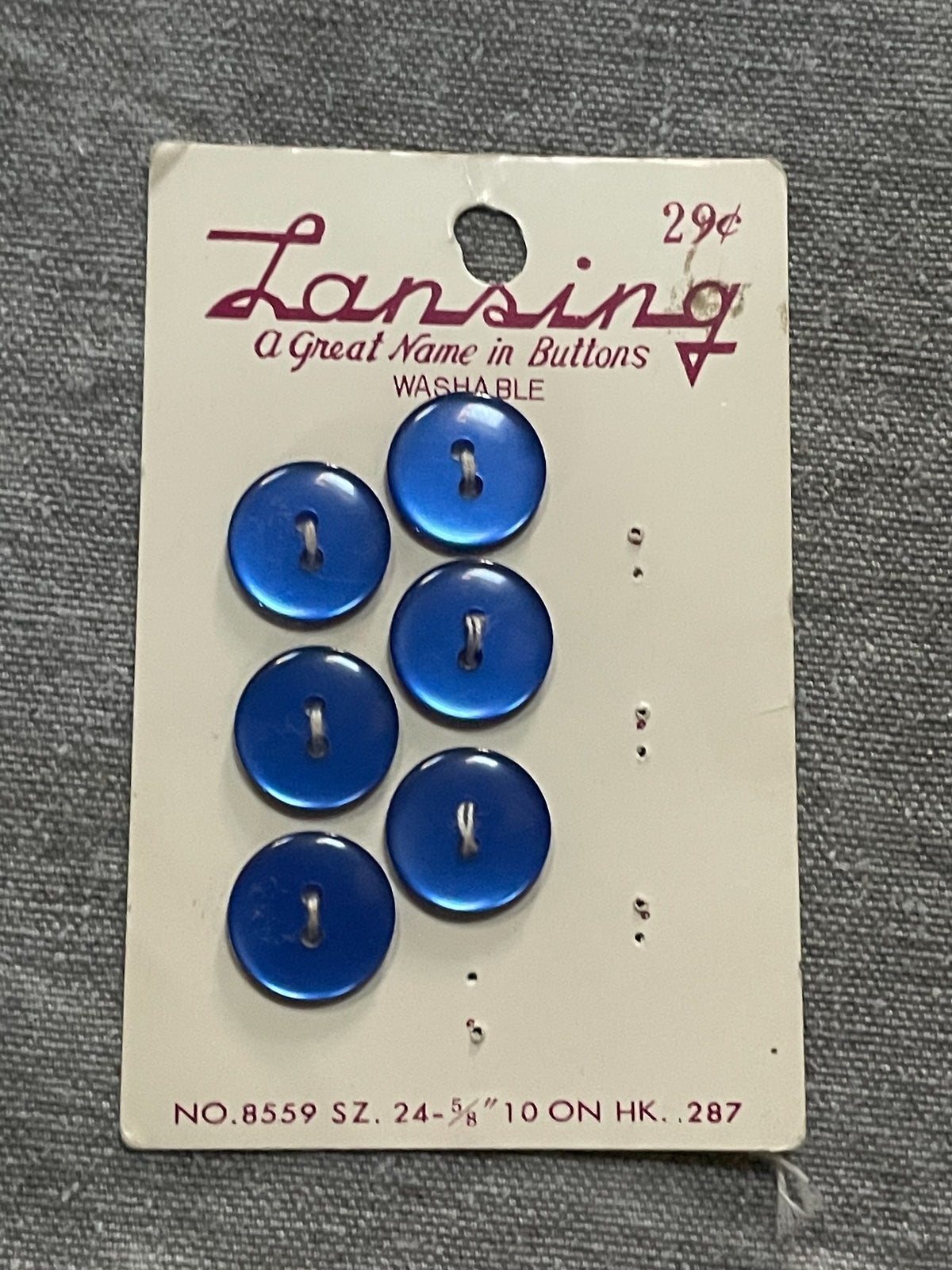 Product view of 6 blue lansing two-hole sewing buttons, 5/8 inch, original card