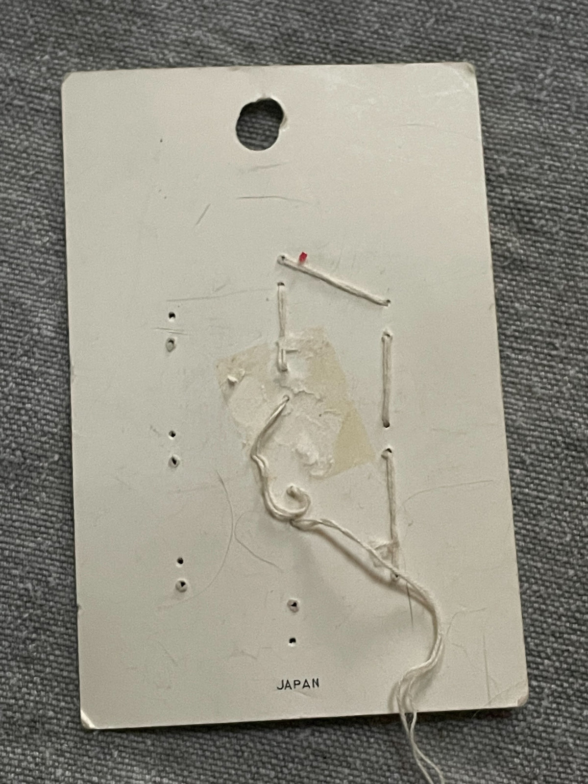 Back of original packaging card for 6 blue lansing two-hole sewing buttons, 5/8 inch, original card