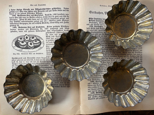 Set of four 19th century tart tins
