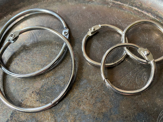 Trio of loose leaf binder rings